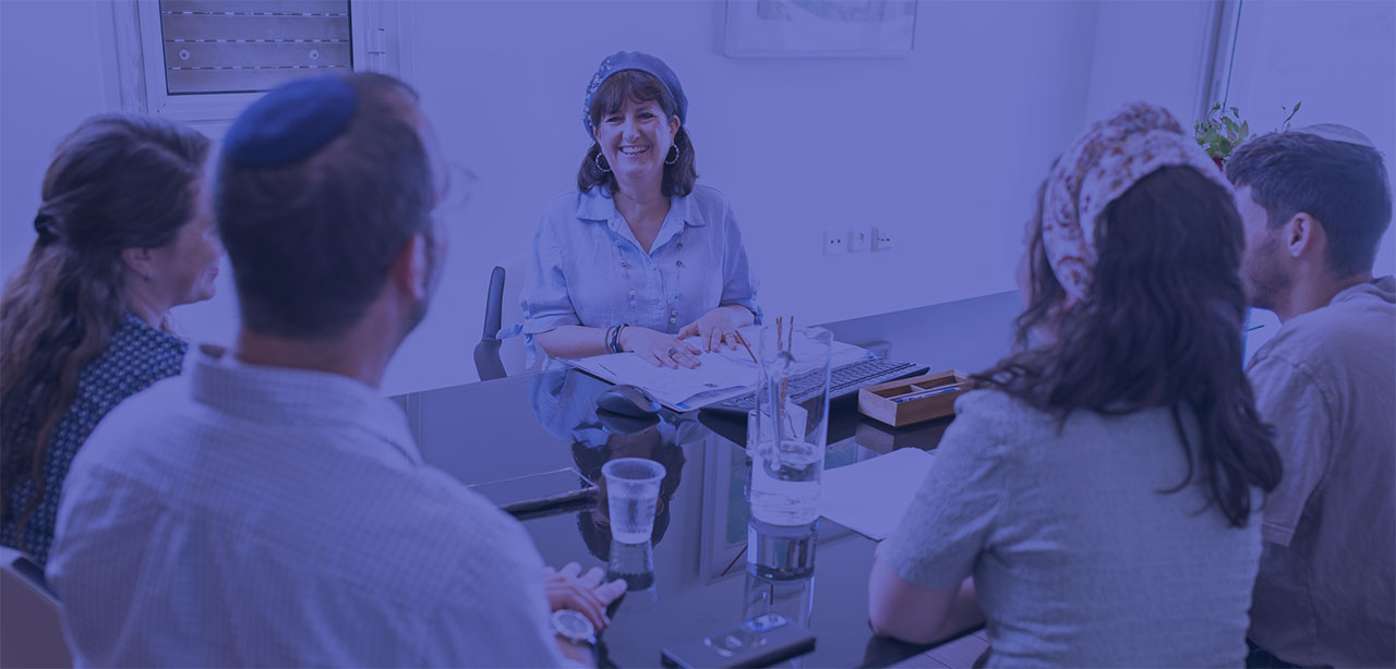 Rena Hollander at the table with 4 clients